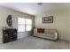Comfortable living room with carpet, sofa, and a stylish wine bar at 1325 E Brent Ct, Casa Grande, AZ 85122