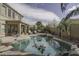 Inviting backyard pool, covered patio, and desert landscaping at 1325 E Brent Ct, Casa Grande, AZ 85122