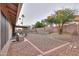 Spacious backyard with a covered patio, stylish outdoor furniture, and low-maintenance desert landscaping at 15018 S 28Th St, Phoenix, AZ 85048