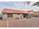 Wide backyard view featuring a covered patio with outdoor seating and low-maintenance desert landscaping at 15018 S 28Th St, Phoenix, AZ 85048
