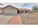 Charming single-story home featuring desert landscaping, a red tile roof, and a two-car garage at 15018 S 28Th St, Phoenix, AZ 85048