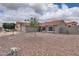 Charming single-story home with desert landscaping, a red tile roof, and a two-car garage at 15018 S 28Th St, Phoenix, AZ 85048