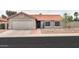 Charming single-story home with desert landscaping, a tile roof, and a two-car garage at 15018 S 28Th St, Phoenix, AZ 85048