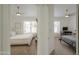 Hallway shot of two bedrooms, each with a ceiling fan and a window at 15018 S 28Th St, Phoenix, AZ 85048