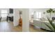 Open floor plan featuring a living room with a sofa, kitchen with breakfast bar, and white walls at 15018 S 28Th St, Phoenix, AZ 85048