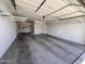 Spacious garage with overhead storage racks, providing ample space for vehicles and storage at 16008 N 109Th Ave, Sun City, AZ 85351