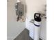 Utility room features a tankless water heater and water filtration system at 16008 N 109Th Ave, Sun City, AZ 85351