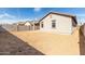 Wide backyard, surrounded by fencing, is ready to customize to your dreams at 17057 W Seldon Ln, Waddell, AZ 85355