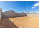 Expansive backyard space with block wall offers a private outdoor area at 17081 W Seldon Ln, Waddell, AZ 85355
