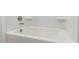 Clean white bathtub featuring modern fixtures and a sleek design at 17081 W Seldon Ln, Waddell, AZ 85355