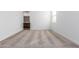 An airy bedroom featuring neutral carpet, white walls, and a window providing natural light at 17081 W Seldon Ln, Waddell, AZ 85355