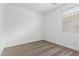 Bright bedroom featuring neutral carpet, white walls, and a window with blinds at 17081 W Seldon Ln, Waddell, AZ 85355