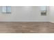 The spacious room offers wood-look tile flooring and natural light from two windows at 17081 W Seldon Ln, Waddell, AZ 85355
