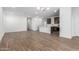 Open floor plan boasts wood-look tile, neutral walls, and easy access to the kitchen at 17081 W Seldon Ln, Waddell, AZ 85355