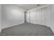 Bedroom with neutral carpet and a closet for additional storage at 17313 W Via Dona Rd, Surprise, AZ 85387