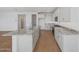 Kitchen with white cabinets, stainless steel appliances, and granite countertops at 17313 W Via Dona Rd, Surprise, AZ 85387