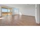 Bright living room with tile floors, large sliding glass doors, and ample natural light at 17313 W Via Dona Rd, Surprise, AZ 85387
