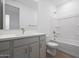 Modern bathroom with a single sink vanity and a shower-tub combo at 17322 W Via Dona Rd, Surprise, AZ 85387
