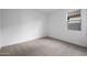 A well-lit bedroom with neutral carpet and a window for natural light at 17322 W Via Dona Rd, Surprise, AZ 85387