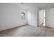 A bright bedroom featuring neutral carpet, a window and a closet door at 17322 W Via Dona Rd, Surprise, AZ 85387