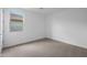Bright, carpeted bedroom with a window offering natural light and exterior views at 17322 W Via Dona Rd, Surprise, AZ 85387