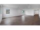 Bright living room featuring neutral walls, recessed lighting, and wood-look tile flooring at 17322 W Via Dona Rd, Surprise, AZ 85387