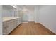 Modern bathroom with a large vanity, a glass shower, and wood-look tile flooring at 17445 W Via Dona Rd, Surprise, AZ 85387