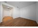 Neutral bedroom with hardwood floors, recessed lighting and large open closet at 17445 W Via Dona Rd, Surprise, AZ 85387
