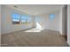 Bright bedroom with plush carpet, and multiple windows for natural light at 17445 W Via Dona Rd, Surprise, AZ 85387