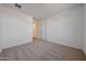 Spacious bedroom with neutral carpet, white walls, two doors and ample natural light creating an inviting atmosphere at 17445 W Via Dona Rd, Surprise, AZ 85387