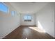Bedroom features recessed lighting, wood-look tile flooring, and three windows providing plenty of natural light at 17445 W Via Dona Rd, Surprise, AZ 85387