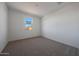 Bedroom featuring neutral carpet, white walls, natural light from window and a minimalistic modern design at 17445 W Via Dona Rd, Surprise, AZ 85387