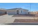 Inviting one story home with a two-car garage, landscaped front yard and covered entry at 17445 W Via Dona Rd, Surprise, AZ 85387