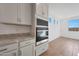Clean-lined kitchen features granite counters, stainless steel appliances including microwave and oven combo, and recessed lighting at 17445 W Via Dona Rd, Surprise, AZ 85387