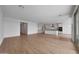 Bright open-concept living space featuring sleek flooring, neutral walls, and natural light, creating a welcoming ambiance at 17445 W Via Dona Rd, Surprise, AZ 85387