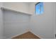 Bright walk-in closet with carpet, a window providing natural light, and a built-in rod for ample storage at 17445 W Via Dona Rd, Surprise, AZ 85387
