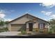 Charming single-story home featuring a tan stucco exterior, two-car garage and desert landscaping at 17619 W Oberlin Way, Surprise, AZ 85387