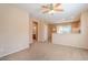 Open living room showcasing the carpet floors and view to the kitchen at 1821 W Morse Dr, Anthem, AZ 85086