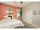 Brightly decorated bedroom with carpet, ceiling fan, and a sliding door closet at 20623 N Enchantment Pass, Maricopa, AZ 85138