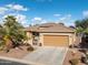 Charming single-story home featuring a spacious garage, desert landscaping, and a welcoming front entrance at 20623 N Enchantment Pass, Maricopa, AZ 85138