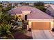 Inviting single-story home with a private courtyard, desert landscaping, and a spacious two-car garage at 20623 N Enchantment Pass, Maricopa, AZ 85138