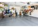 Spacious garage with epoxy floor and overhead storage at 20623 N Enchantment Pass, Maricopa, AZ 85138
