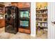 Kitchen featuring stainless steel appliances, built in oven and refrigerator, and pantry at 20623 N Enchantment Pass, Maricopa, AZ 85138