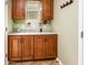 Well-lit mud room with granite countertop and cabinet storage at 20623 N Enchantment Pass, Maricopa, AZ 85138