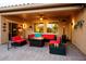 Charming outdoor patio featuring a fire pit, comfortable seating, and a cozy ambiance perfect for relaxation and entertaining at 20623 N Enchantment Pass, Maricopa, AZ 85138