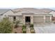 Exterior home elevation featuring a manicured front yard and neutral stucco facade and roof at 2113 W Samantha Way, Phoenix, AZ 85041