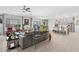 Inviting open-concept living room with ceiling fan and stylish decor provides a comfortable space for relaxation and entertainment at 2113 W Samantha Way, Phoenix, AZ 85041