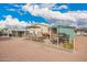 Fully fenced backyard showcases multiple outdoor living areas and well-maintained landscaping at 2206 S Ellsworth Rd # 149B, Mesa, AZ 85209