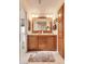 Bathroom featuring a double sink vanity, large mirror, and modern lighting fixtures at 2206 S Ellsworth Rd # 149B, Mesa, AZ 85209