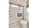 Clean, white bathroom featuring a glass-enclosed shower and a modern toilet at 2206 S Ellsworth Rd # 149B, Mesa, AZ 85209